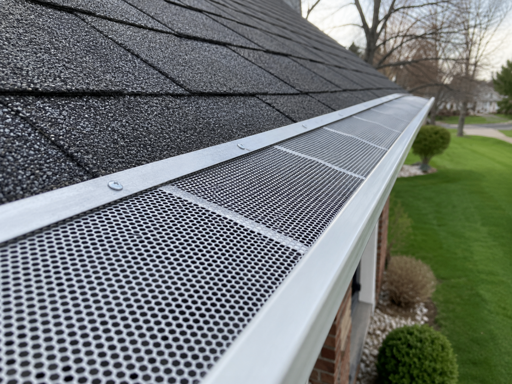 Close-up of a professionally installed micro-mesh gutter guard system on an Indianapolis IN home, designed to help reduce leaf buildup and improve gutter drainage